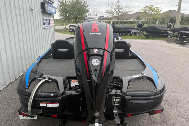 Slide: The Image of 2022 Nitro Z18 boat with 150 Pro motor, parked outdoors near dealership. - 6