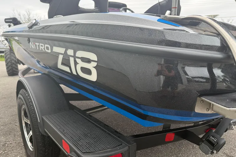 Slide: The Image of 2022 Nitro Z18 boat on trailer, showcasing sleek design and branding. - 7