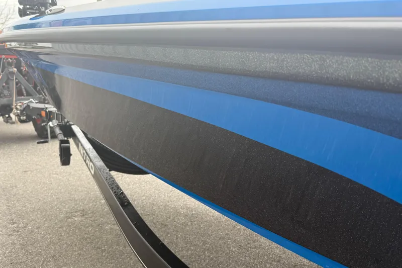 Slide: The Image of 2022 Nitro Z18 boat with sleek blue and black hull design. - 8