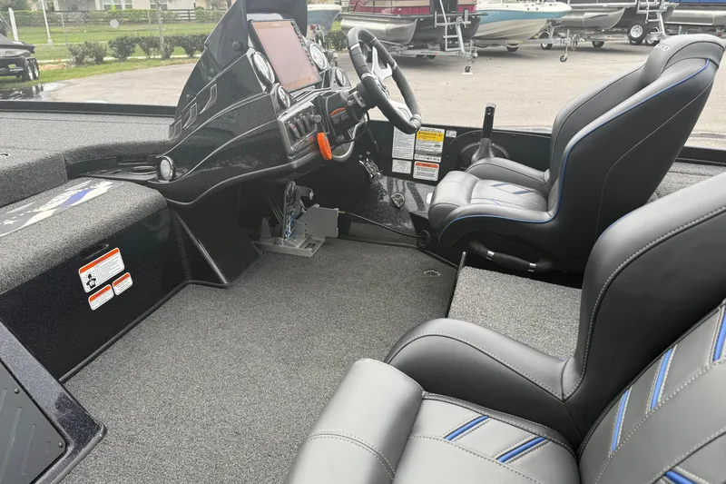 Slide: The Image of Interior of a 2022 Nitro Z18 boat with modern dashboard and seating. - 9