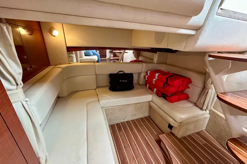 Slide: The Image of Interior of 2005 Sea Ray Sundancer 320 with seating and life jackets. - 12