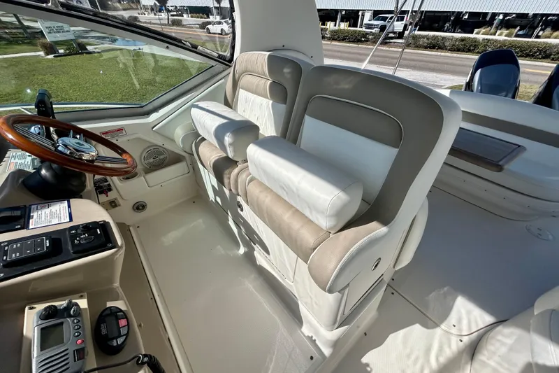 Slide: The Image of Interior of 2005 Sea Ray Sundancer 320 boat with helm and seating area. - 16