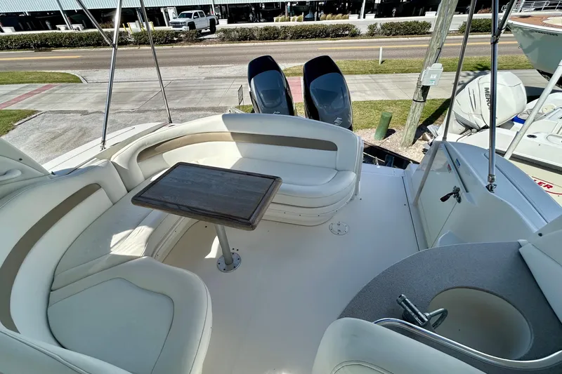 Slide: The Image of 2005 Sea Ray Sundancer 320 boat interior with seating and table. - 21
