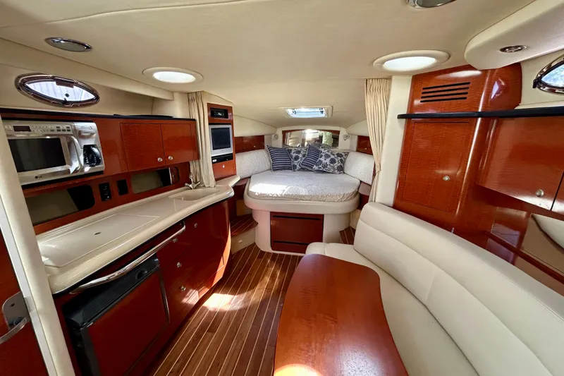 Slide: The Image of Luxurious interior of 2005 Sea Ray Sundancer 320 yacht with wood finishes and cozy seating. - 7