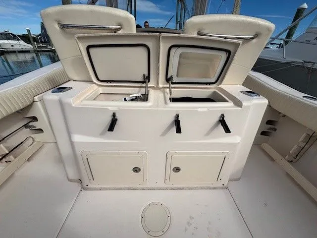 Slide: The Image of 2008 Grady-White Bimini 306 boat with open storage hatch. - 13