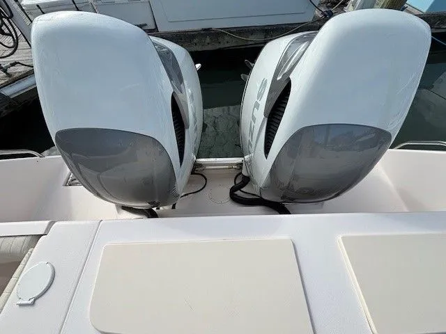 Slide: The Image of 2008 Grady-White Bimini 306 with twin outboard engines at the dock. - 15