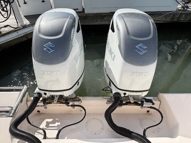 Slide: The Image of Two Suzuki 350 outboard engines on a Grady-White Bimini 306 boat. - 16