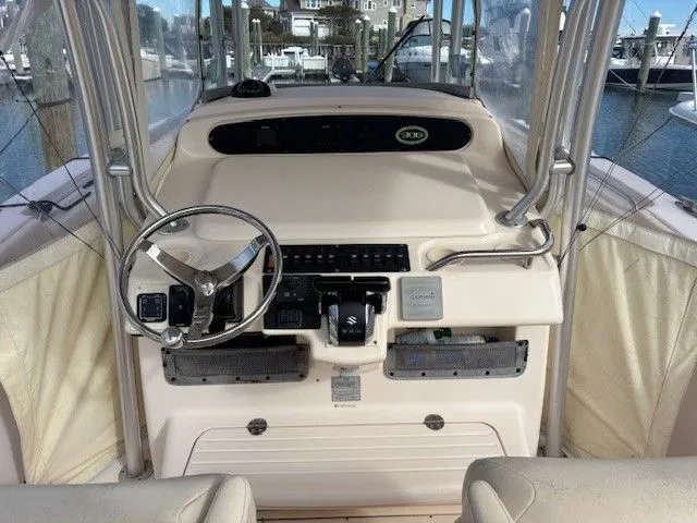 Slide: The Image of Helm console of a 2008 Grady-White Bimini 306 boat in harbor. - 8