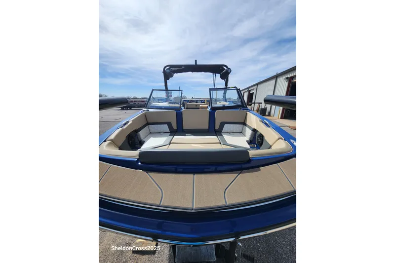 Slide: The Image of 2026 Heyday H22 boat with spacious seating and sleek design at a marina. - 4