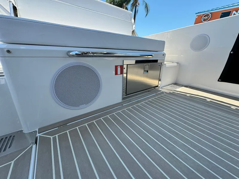 Slide: The Image of 2024 Windy SR28 CC boat deck with storage and speaker. - 21