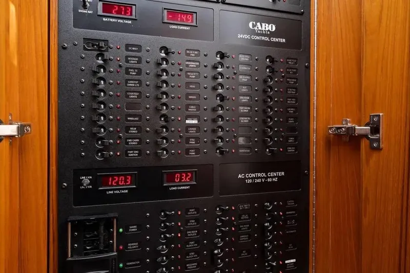 Slide: The Image of Electrical control panel of a 2012 Cabo 44 Hardtop Express yacht. - 19