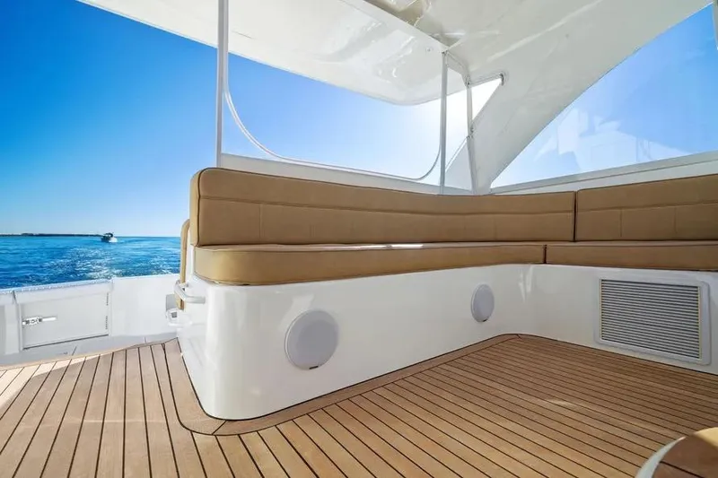 Slide: The Image of Luxurious 2012 Cabo 44 Hardtop Express yacht interior with ocean view and teak flooring. - 26