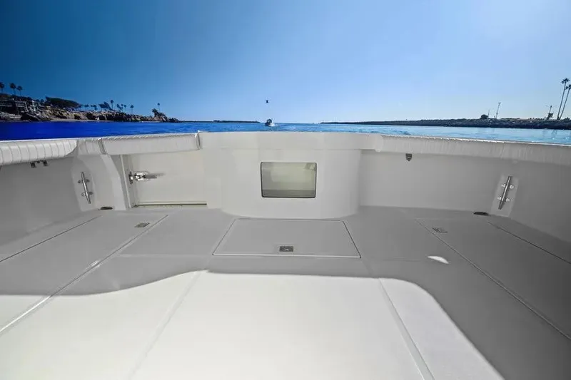 Slide: The Image of 2012 Cabo 44 Hardtop Express boat deck with ocean view. - 27