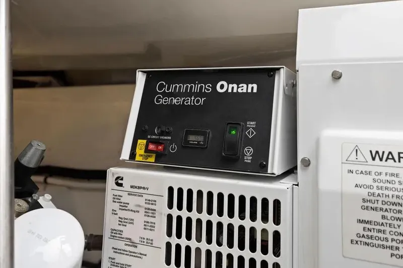 Slide: The Image of Cummins Onan generator in 2012 Cabo 44 Hardtop Express yacht engine room. - 31