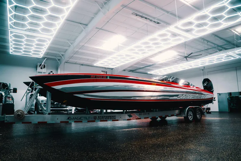 The Image of High-performance Statement 360 CAT boat in a modern showroom, 2025 model. - 0