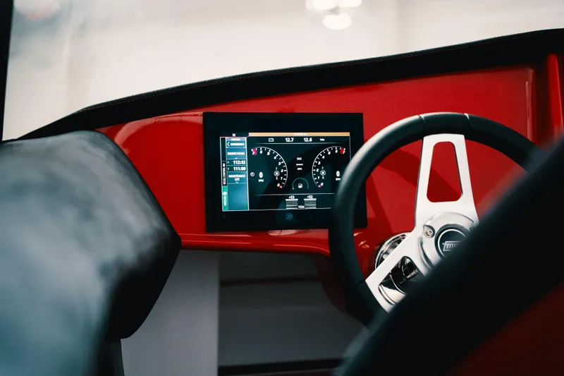 Slide: The Image of Interior dashboard of 2025 Statement 360 CAT with digital display and steering wheel. - 18