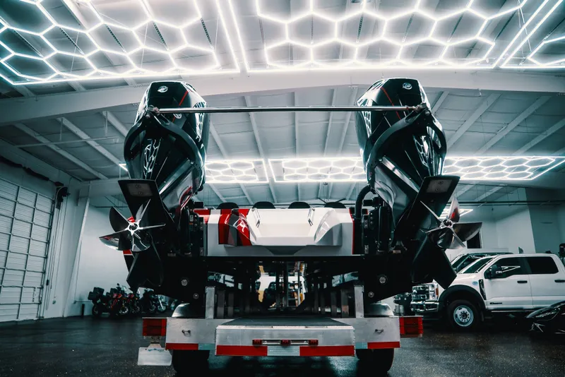 Slide: The Image of 2025 Statement 360 CAT boat with dual engines in a modern showroom. - 25