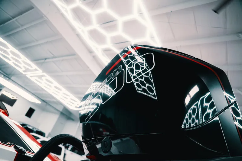 Slide: The Image of Sleek 2025 Statement 360 CAT engine with futuristic lighting reflections in a modern showroom. - 26