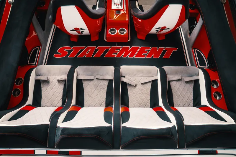Slide: The Image of Luxurious interior of 2025 Statement 360 CAT with stylish seating and bold branding. - 7