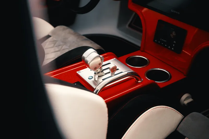 Slide: The Image of Interior of 2025 Statement 360 CAT with sleek red console and modern controls. - 8