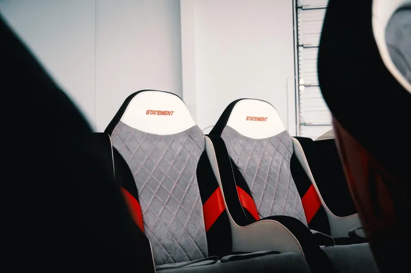 Slide: The Image of Modern Statement 360 CAT car seats, 2025 model, featuring sleek design and red accents. - 9