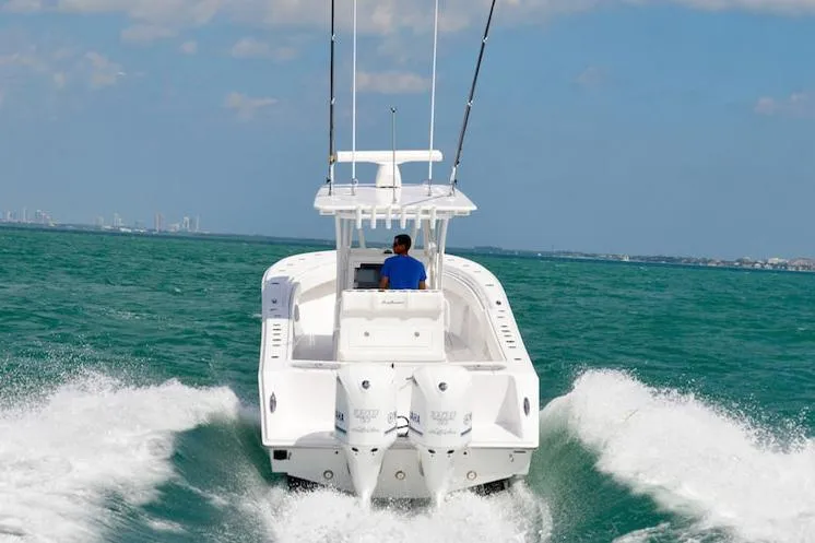Slide: The Image of Manufacturer Provided Image: 2025 SeaHunter 31 Tournament boat cruising on open water. - 3