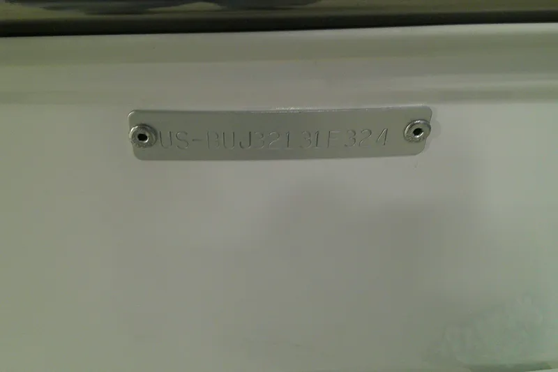 Slide: The Image of 2024 Tahoe T18 identification plate with serial number on a white surface. - 4