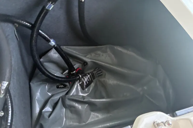 Slide: The Image of 2018 MasterCraft NXT22 ballast system with hoses and fill valve. - 11