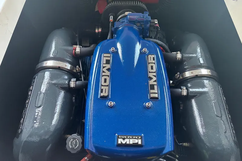 Slide: The Image of 2018 MasterCraft NXT22 Ilmor 5000 MPI engine, blue cover, detailed view. - 15