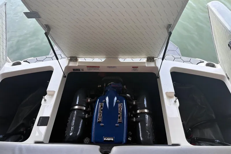 Slide: The Image of 2018 MasterCraft NXT22 boat engine compartment with Ilmor engine visible. - 16