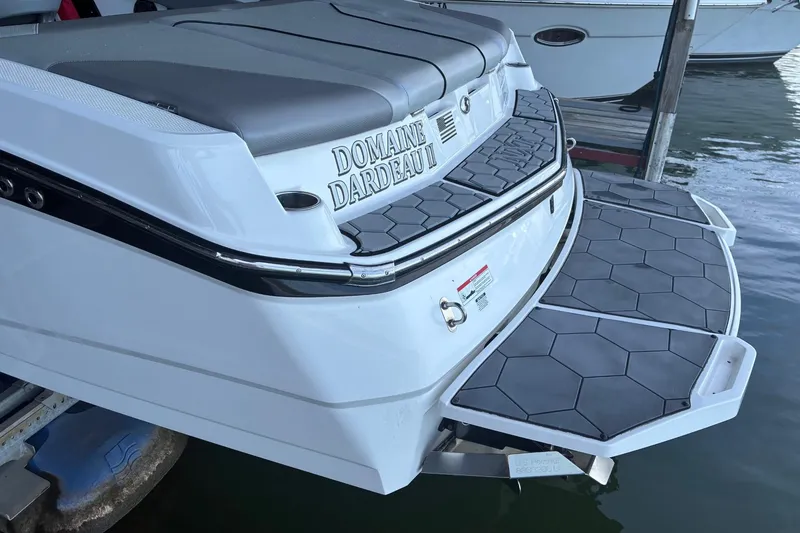 Slide: The Image of 2018 MasterCraft NXT22 boat with custom swim platform and seating. - 17