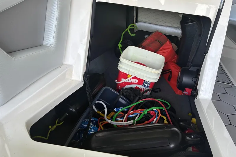Slide: The Image of Storage compartment of a 2018 MasterCraft NXT22 boat with ropes and equipment. - 19