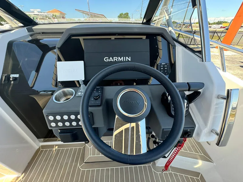 Slide: The Image of 2024 Windy SR28 CC boat helm with Garmin navigation system. - 12