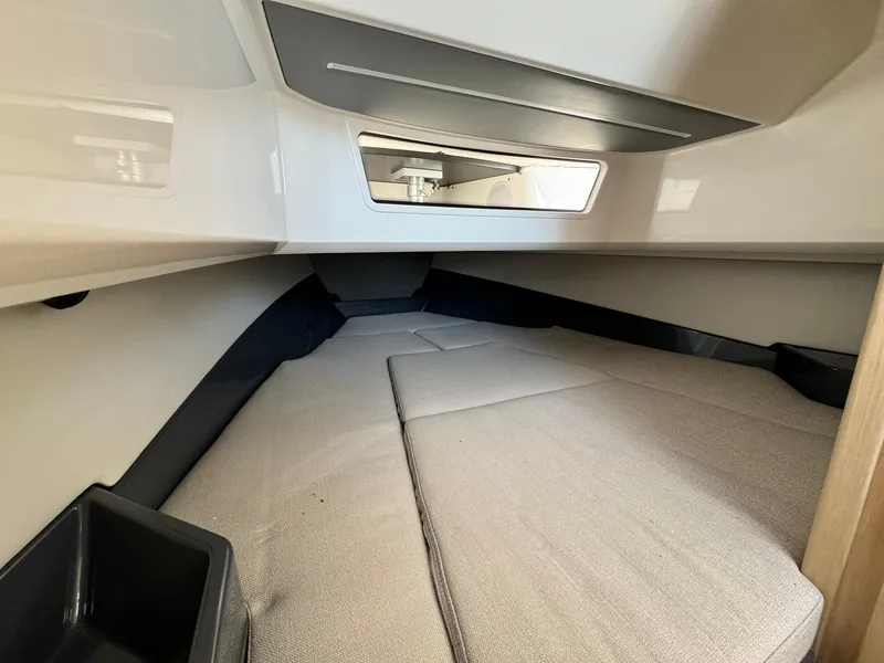 Slide: The Image of Interior cabin of 2024 Windy SR28 CC boat with cushioned sleeping area. - 15