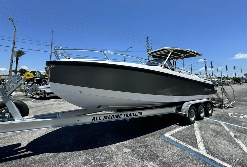 Slide: The Image of 2024 Windy SR28 CC boat on a trailer in a parking lot. - 3