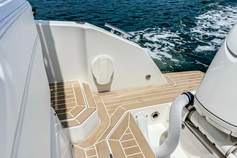 Slide: The Image of The image shows the stern of a 2024 Windy SR28 CC boat with a modern design. - 22