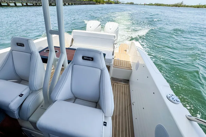 Slide: The Image of The image shows the cockpit of a 2024 Windy SR28 CC boat on the water. - 16