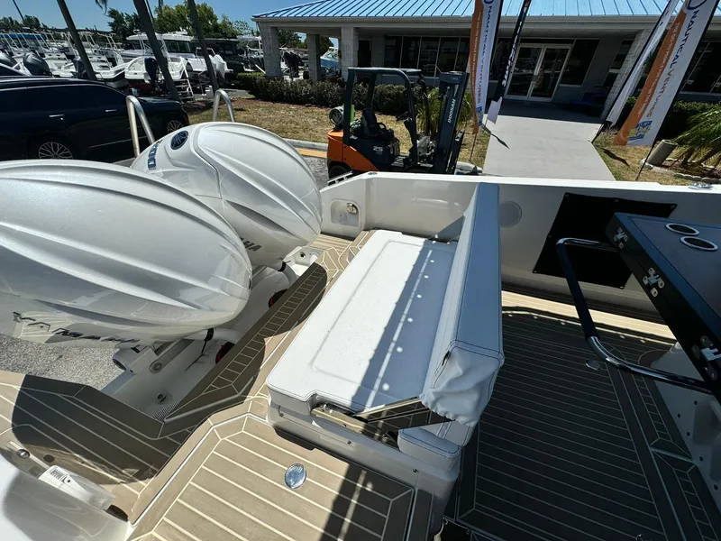 Slide: The Image of 2024 Windy SR28 CC boat with dual outboard engines and rear seating. - 20
