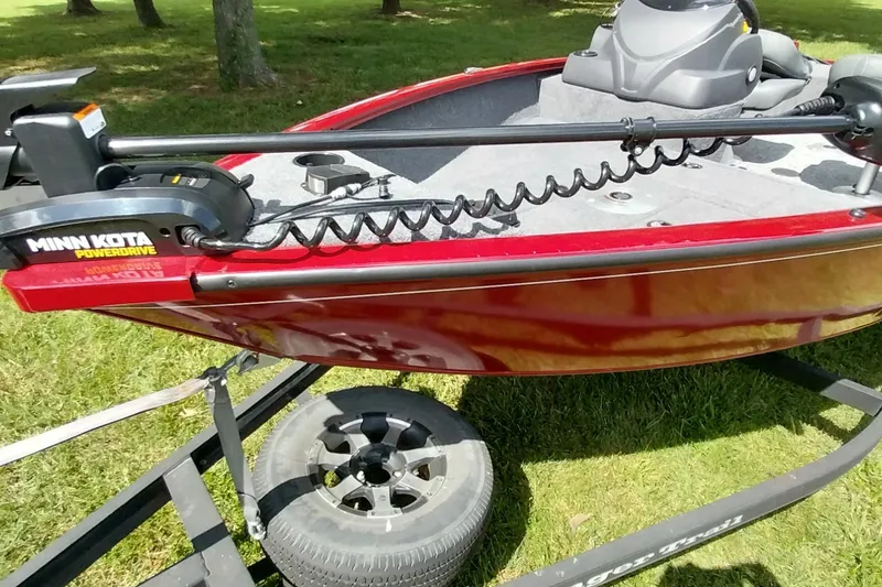 Slide: The Image of 2025 Tracker Super Guide V-16 SC boat with Minn Kota PowerDrive motor on trailer. - 13