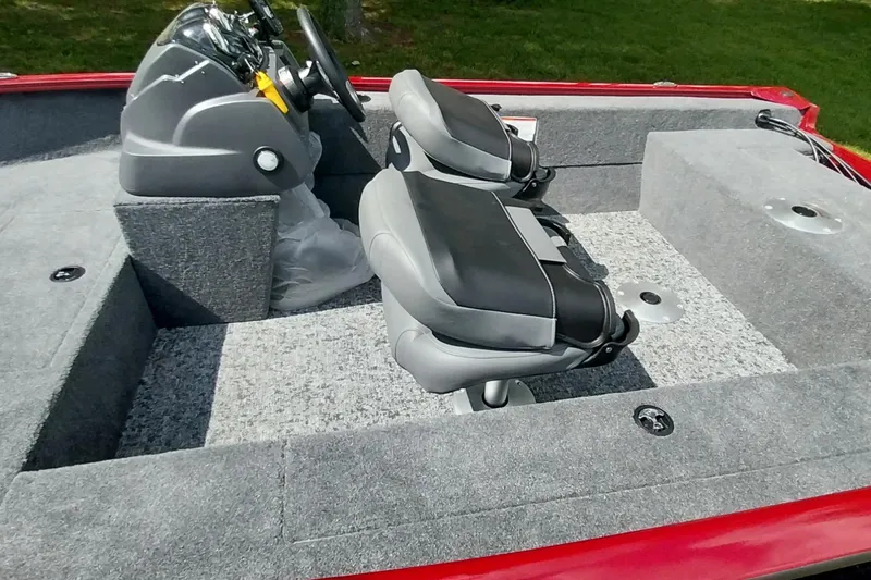 Slide: The Image of 2025 Tracker Super Guide V-16 SC boat interior with dual seats and steering console. - 17