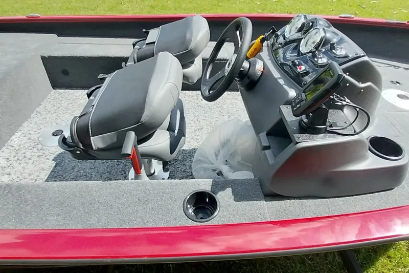 Slide: The Image of 2025 Tracker Super Guide V-16 SC boat interior with dual seats and control console. - 3