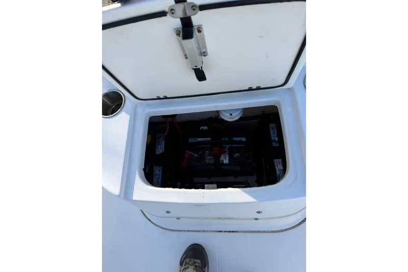 Slide: The Image of Open battery compartment on a 2008 Seapro 206CC boat. - 10