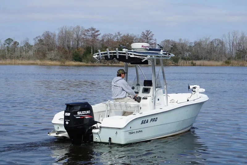 Slide: The Image of 2008 Seapro 206CC boat with Suzuki engine on a calm lake. - 3