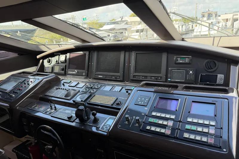 Slide: The Image of Cockpit of 2005 Mangusta 92 yacht with advanced navigation and control systems. - 10
