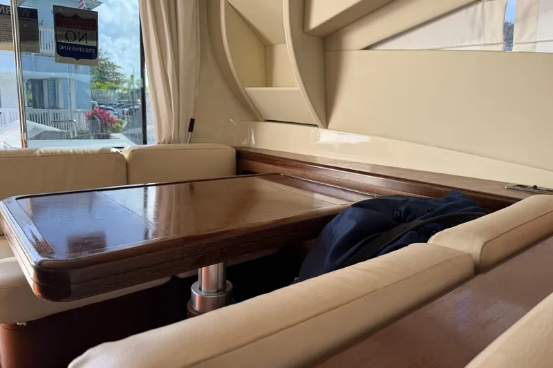 Slide: The Image of Luxurious interior of a 2005 Mangusta 92 yacht with elegant wood table and cream seating. - 12