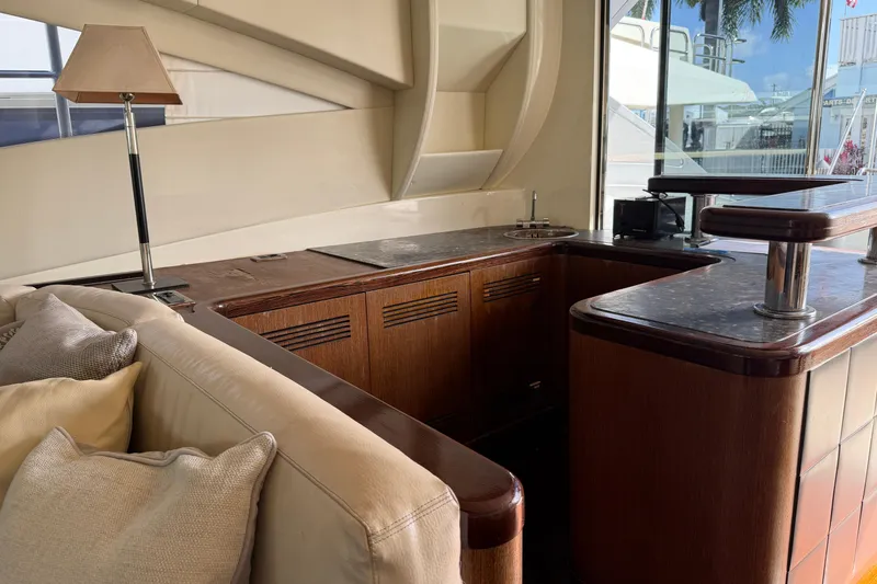 Slide: The Image of Luxurious interior of a 2005 Mangusta 92 yacht with elegant wood and leather furnishings. - 13