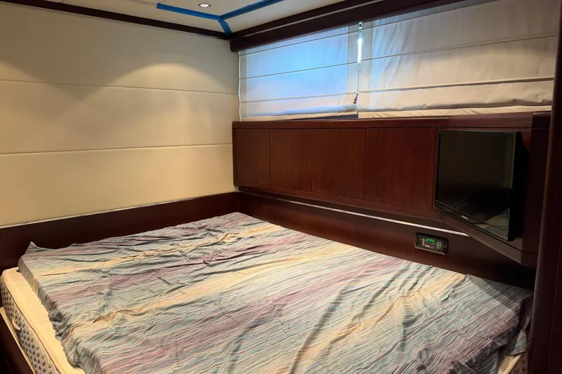 Slide: The Image of Luxurious bedroom interior of 2005 Mangusta 92 yacht with cozy bedding and modern design. - 23