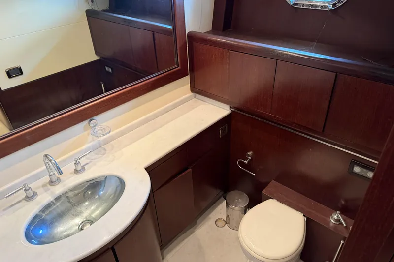 Slide: The Image of Luxurious bathroom interior of 2005 Mangusta 92 yacht with wooden cabinetry and modern fixtures. - 30