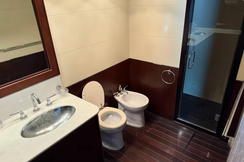 Slide: The Image of Luxurious bathroom in 2005 Mangusta 92 yacht with modern fixtures and wooden flooring. - 33