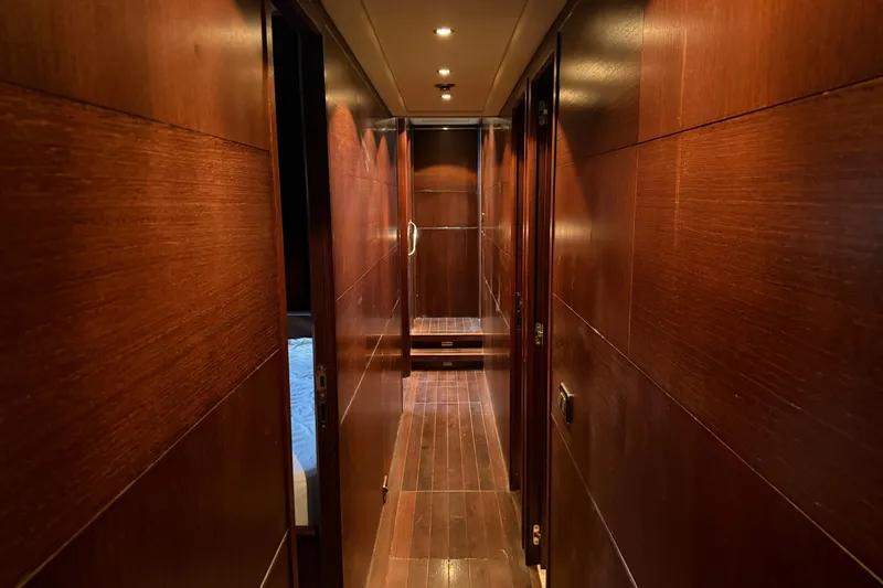 Slide: The Image of Luxurious wooden interior hallway of a 2005 Mangusta 92 yacht. - 37